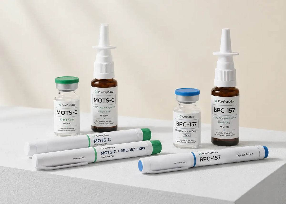 Set of peptide vials, pen syringes and nasal sprays on a white podium from PurePeptides